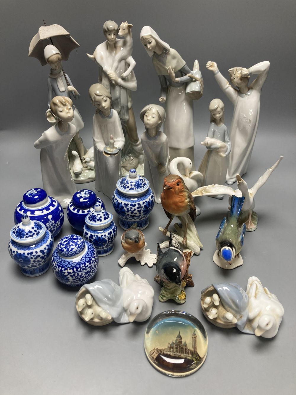 A collection of Lladro and Goebel porcelain figures and other items